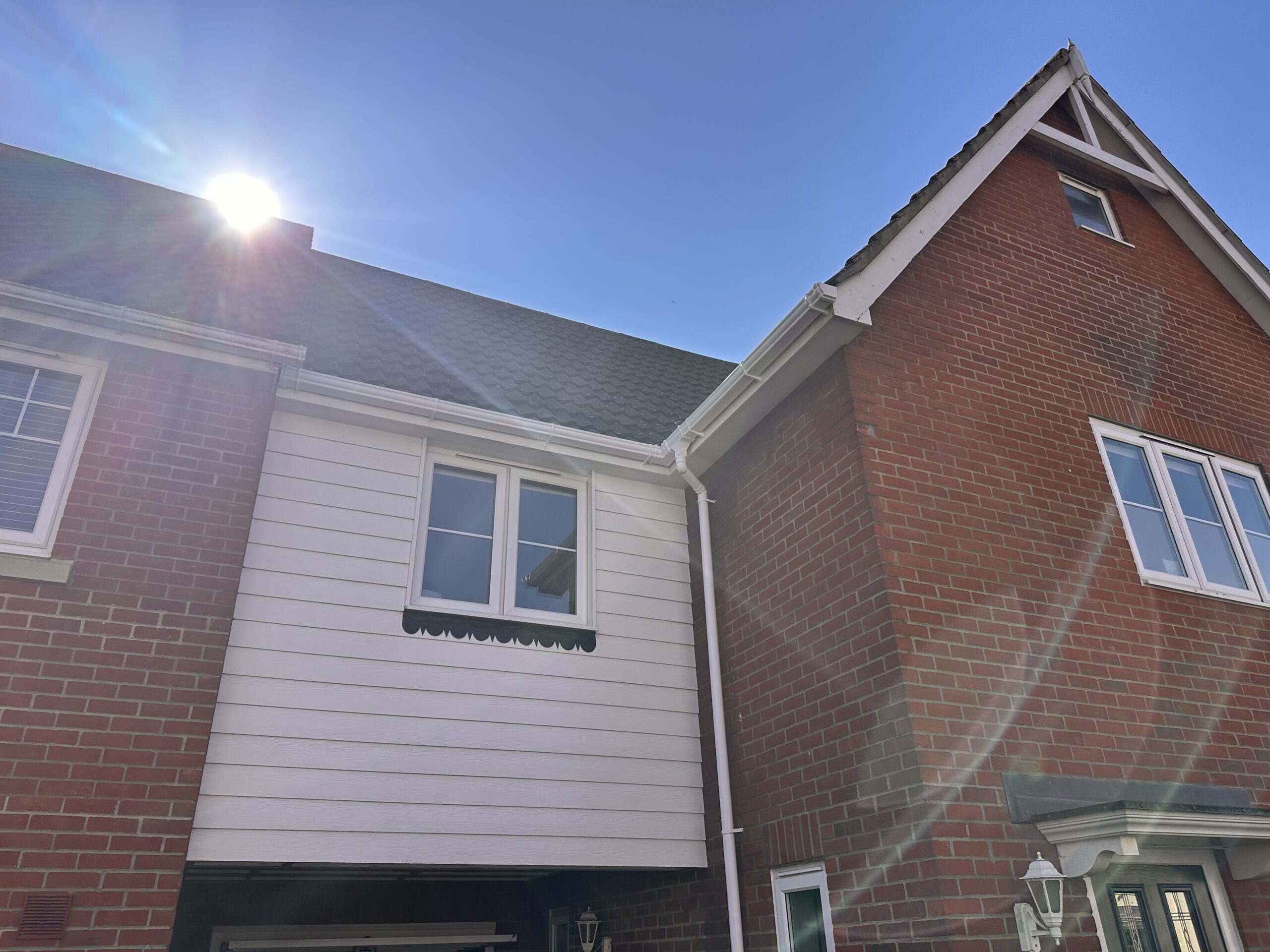 White wooden exterior of brick house